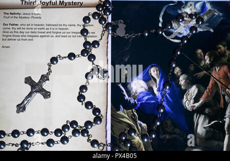 Christian Rosary on a digital tablet.  Catholic prayer. The Third Joyful Mystery : the Nativity. Stock Photo