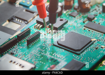 Printed Circuit Board with many electrical components. Stock Photo
