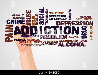 Addiction word cloud and hand with marker concept on white background. Stock Photo