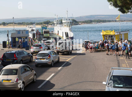 Vehicles boarding the Sandbanks to Shell Bay Studland ferry boat, Sandbanks, Dorset, England, UK Stock Photo