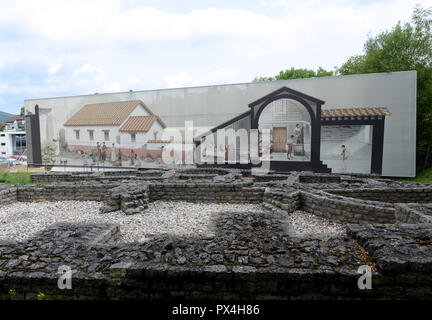 Bath complex and well house ruins with depiction of what it may have looked like. Augusta Raurica, Switzerland Stock Photo