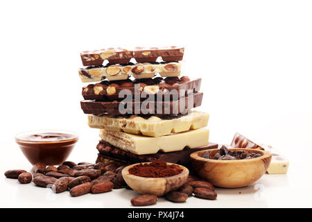 Chocolate bars on table with chocolate tower. Chocolate and nuts Stock Photo