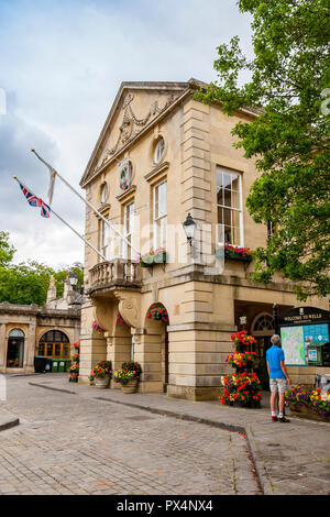 Colourful floral decorations adorn the imposing Town Hall in the Market Square at Wells, Somerset, England, UK Stock Photo
