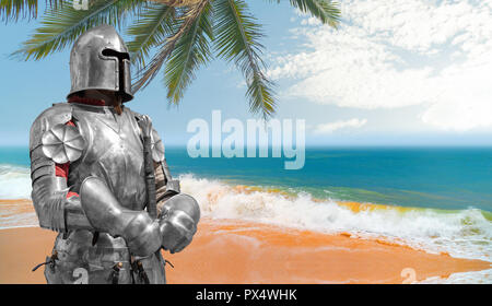 Knight in helmet and metal armor. Stock Photo