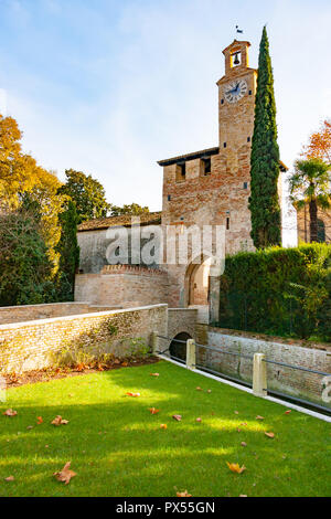 North tower and moat of medieval village in Cordovado, Friuli Venezia-Giulia, Italy Stock Photo