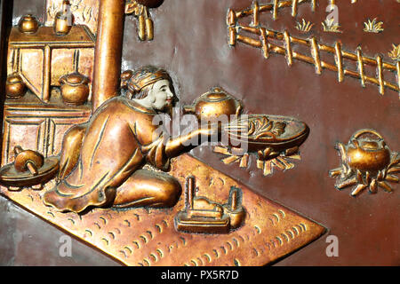 Museum of Traditional Vietnamese Medicine.  Wood carved relief of traditional medicine. Nguyen Dai Nanh ( 15 th century ). The book of acupuncture.  H Stock Photo