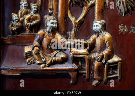 Museum of Traditional Vietnamese Medicine.  Wood carved relief of traditional medicine. Trinh Dinh Ngoan ( 18 th century). The head of the institution Stock Photo