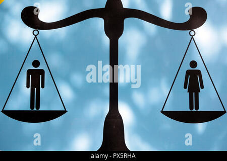 Male and female figures on scale. Gender equality.  Vung Tau. Vietnam. Stock Photo