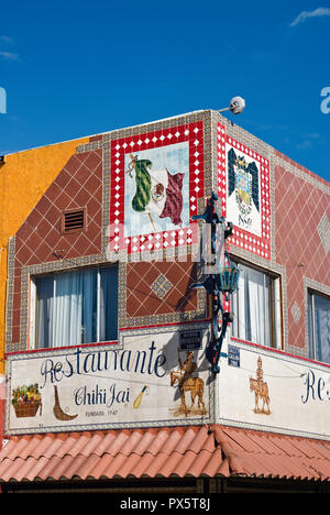 Mexican flag and Tijuana coat of arms in restaurant tile sign at Avenida Revolucion, Tijuana, Baja California, Mexico Stock Photo