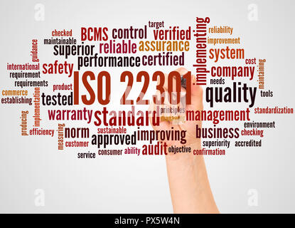 ISO 22301 - Business Continuity Management, word cloud and hand with marker concept on white background. Stock Photo