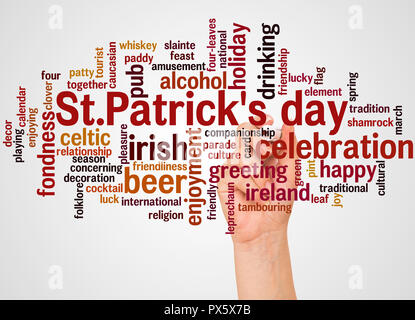 St Patricks day word cloud and hand with marker concept on white background. Stock Photo