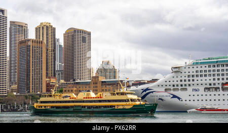 Freshwater Class Manly ferry leaving Circular Quay and the P&O Pacific Explorer berthed at the International Passenger Teminal Sydney NSW Australia. Stock Photo