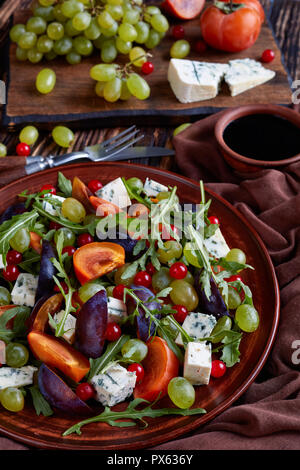 Blue cheese with mold served salad leaves on wood background Stock ...