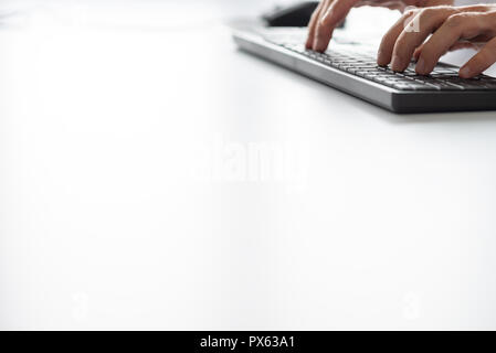 Businessman typing on computer keyboard. With copy space ready for your text. Stock Photo