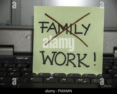 Memo note on notebook, familiy crossed work Stock Photo