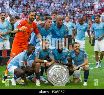 Man City players pose with the Community Shield during the The FA Community Shield Final match between Chelsea and Manchester City at Stamford Bridge, Stock Photo