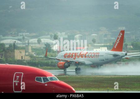 EasyJet plane take off on wet runway, Palma de Mallorca, Spain Stock Photo