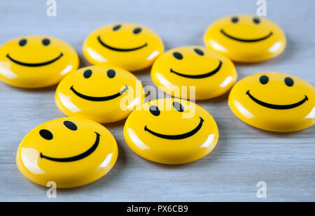 emoticon icons on wooden background close up Stock Photo