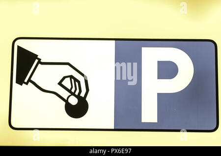 Sign, parking, hand with a coin, pay, ticket machine Stock Photo