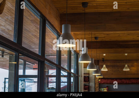 Suspended ceiling lamp sorted in a row, vintage style. Stock Photo