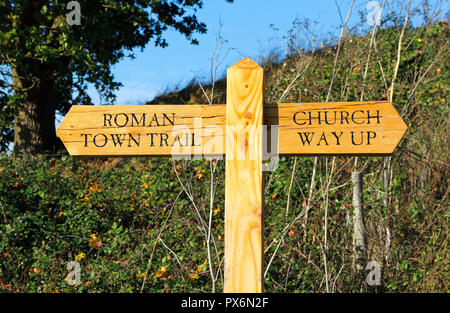 A fingerpost sign on footpath indicating way to Church and Venta Icenorum Roman Town Trail at Caistor St Edmund, Norfolk, England, UK, Europe. Stock Photo