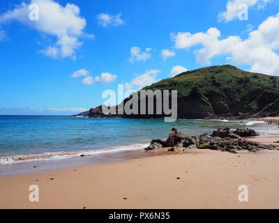 A sunny day on the golden sands of Greve de lecq beach, in jersey Stock Photo