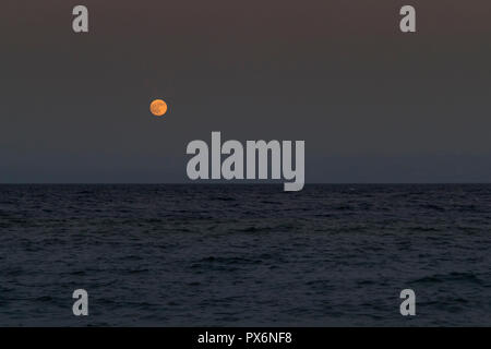 Moonrise over the red sea, Egypt Stock Photo