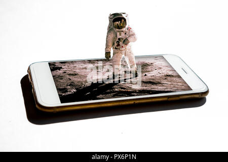 3D astronaut coming out from the smartphone - 3d future technology digital world concept  Elements of this image furnished by NASA Stock Photo