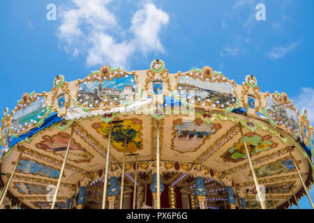 Carousel roundabout canopy against blue sky Stock Photo