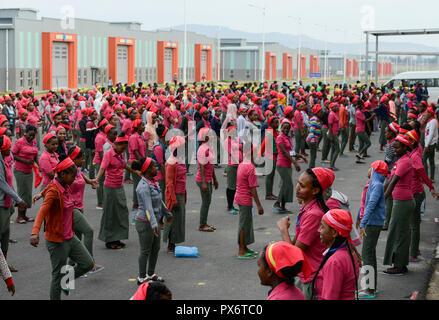 ETHIOPIA , Southern Nations, Hawassa or Awasa, Hawassa Industrial Park, chinese-built for the ethiopian government to attract foreign investors with low rent and tax free to establish a textile industry and create thousands of new jobs, taiwanese company Everest Textile Co. Ltd., women worker do a 15 minutes morning sports before work as motivation training