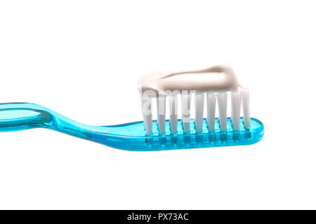 A Simple Toothbrush on a White Background with Toothpaste Applied to the Bristles Stock Photo