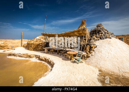 Salt spa with salty pool and stone shack  on African island of Cabo Verde, near Santa Maria Stock Photo