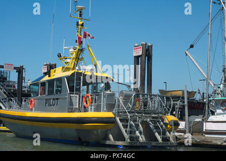 A pilot boat sits ready to carry a marine pilot out to in incoming vessel in Steveston, Richmond, British Columbia, Canada Stock Photo