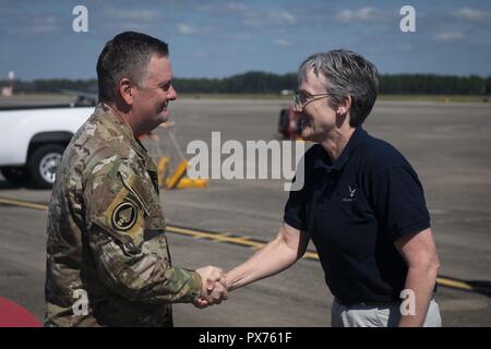 U.S. Air Force Lt. Gen. Brad Webb, left, commander of Air Force Special Operations Command, greets Secretary of the Air Force Heather Wilson at Hurlburt Field, Florida, Oct. 14, 2018, October 14, 2018. Aircrew members with the 8th Special Operations Squadron transported Air Force senior leaders from Hurlburt Field to Tyndall Air Force Base to assess the damage from Hurricane Michael, one of the most intense tropical cyclones to ever hit the U.S. (U.S. Air Force photo by Senior Airman Joseph Pick). () Stock Photo