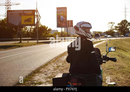 Half-turned biker on his motorcycle Stock Photo