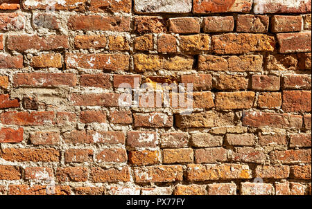 Background of old weathered red brick wall. Bricks masonry as texture Stock Photo