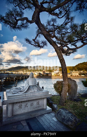 Statue of Murasaki Shikibu, Lady Murasaki, Japanese novelist and poet, by Uji-bashi bridge in Uji, Kyoto Prefecture, Japan 2017 Stock Photo