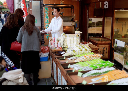 People sampling green tea at a Japanese tea shop in Uji, Kyoto prefecture, Japan 2017 Stock Photo