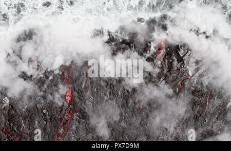 Lava Flow Into The Ocean At Kilauea Active Volcano, Hawaii Stock Photo