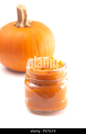 A Glass Canning Jar Filled with Pumpkin Puree Stock Photo