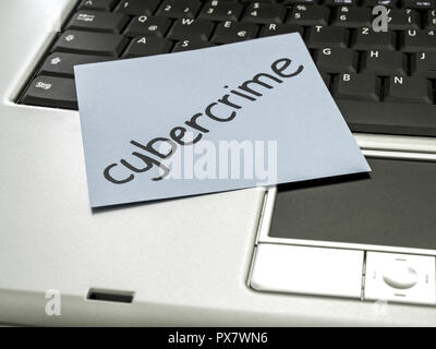 Memo note on notebook, cybercrime Stock Photo