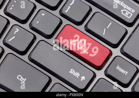 2019 on red enter key, of a black keyboard. Stock Photo