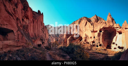 Cave town and rock formations in Zelve Valley, Cappadocia, Turkey. Panoramic view. Stock Photo