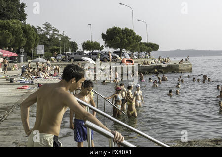 Piran, People At The Beach, Slovenia, Southern Slovenia Stock Photo - Alamy