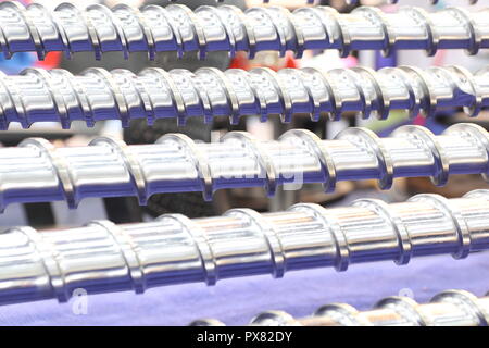 Screw press parts for plastic injection machine ; selective focus Stock Photo