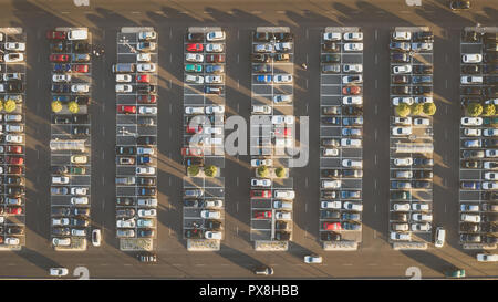 Top down view from drone on mall parking with many cars. Stock Photo