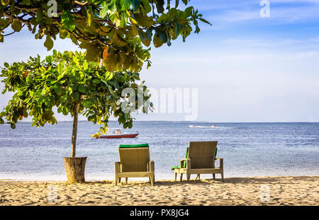 Paradise sandy Nusa Dua beach on Bali island, Indonesia Stock Photo