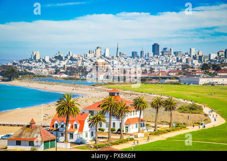 Panoramic view of San Francisco skyline with historic Crissy Field and former USCG Fort Point Life Boat Station (LBS) in the foreground in summer Stock Photo