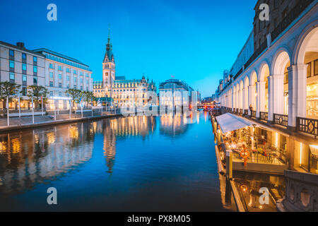 Classic twilight view of Hamburg city center with historic town hall reflecting in Binnenalster during blue hour at dusk, Germany Stock Photo