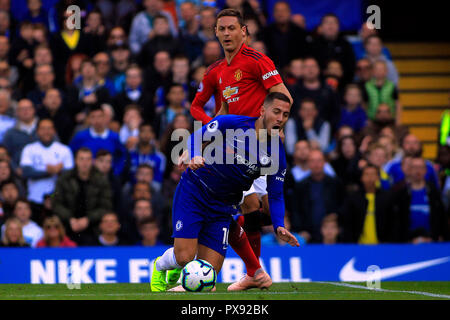 London, UK. 20th Oct, 2018. Eden Hazard of Chelsea (L) is fouled by Nemanja Matic of Manchester United (R). Premier League match, Chelsea v Manchester United at Stamford Bridge in London on Saturday 20th October 2018. this image may only be used for Editorial purposes. Editorial use only, license required for commercial use. No use in betting, games or a single club/league/player publications. pic by Steffan Bowen/ Credit: Andrew Orchard sports photography/Alamy Live News Stock Photo